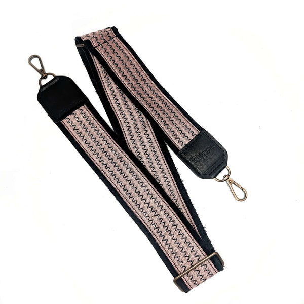 Pink and Black Bag strap with zigzag pattern on a white background