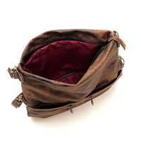 Interior view of the Original Lauren leather crossbody bag showcasing its spacious design and burgundy lining.
