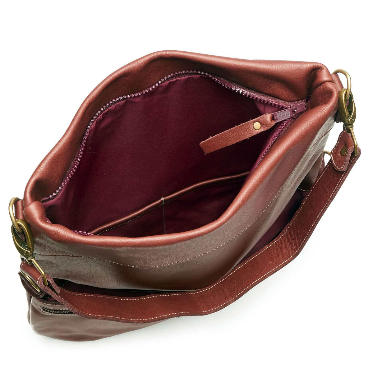 Interior view of the Original Lauren leather crossbody bag, showcasing its rich Merlot leather and spacious design.