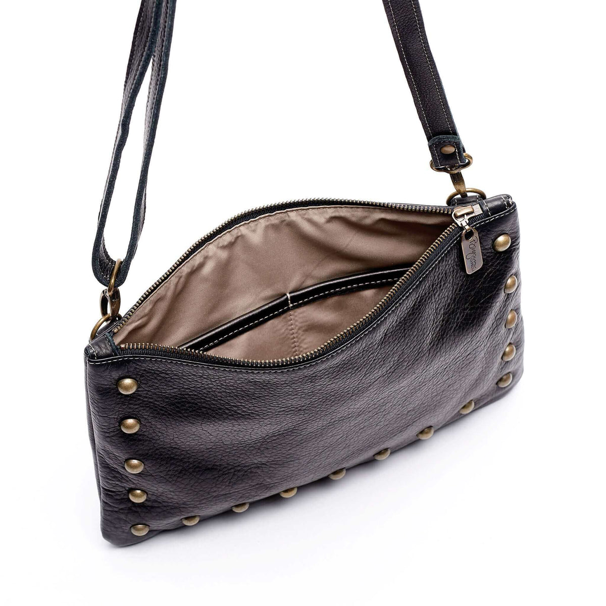 Interior of studded bag in black full-grain leather small crossbody bag with detachable strap