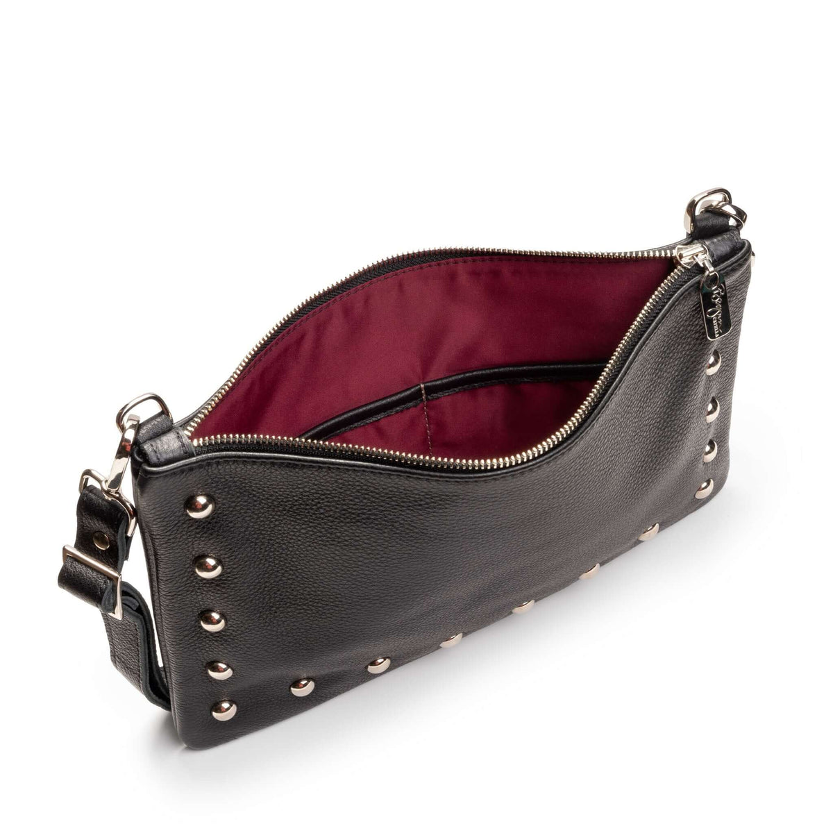 Interior of studded crossbody bag in black full-grain leather small crossbody bag with detachable strap