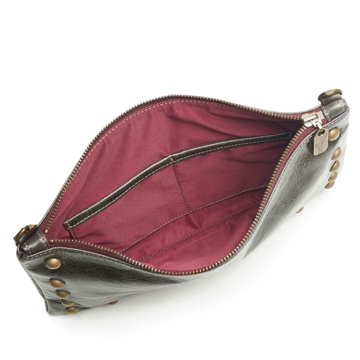 Interior of studded crossbody bag in dark charcoal full-grain leather small crossbody bag with detachable strap