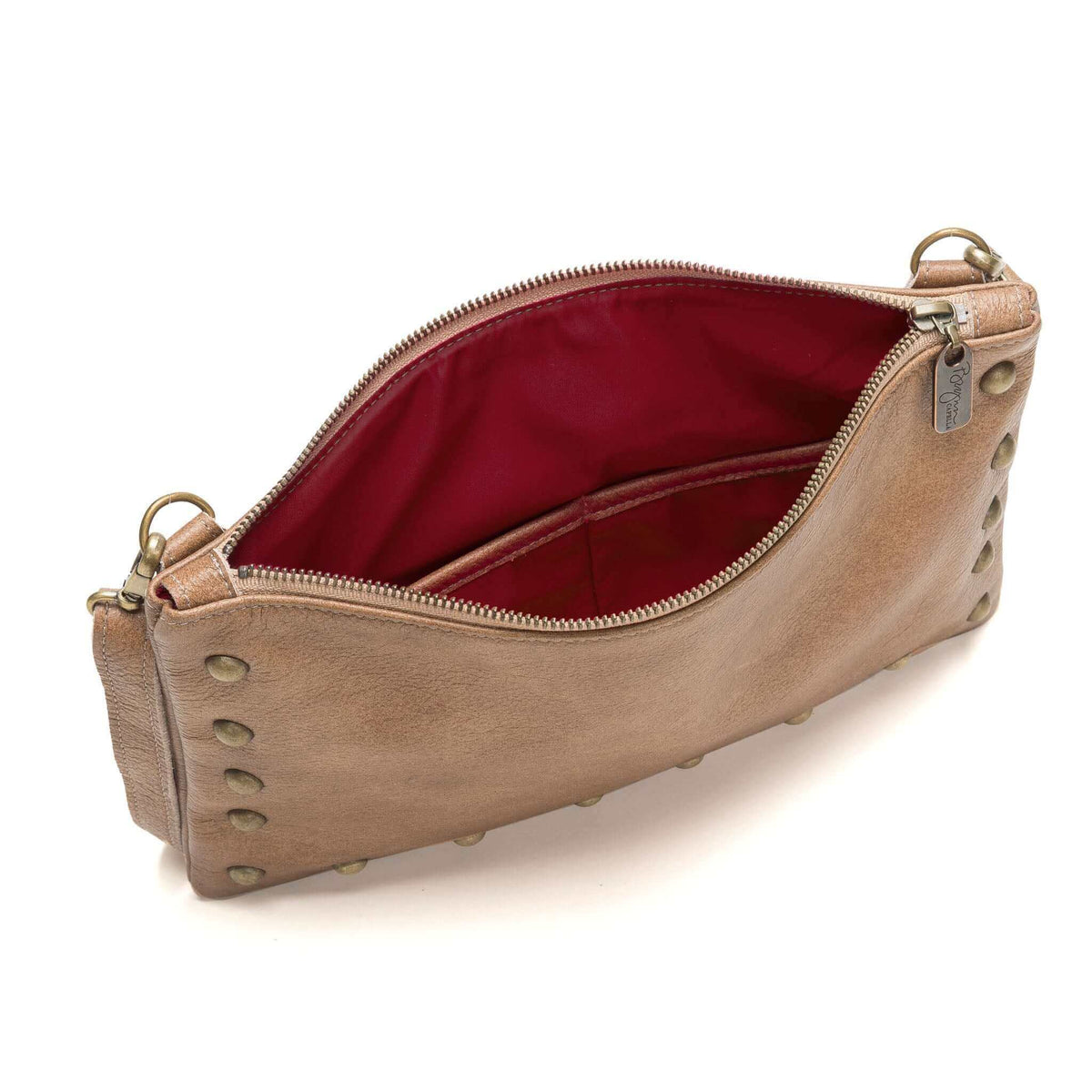 Interior of studded crossbody bag in golden tan full-grain leather small crossbody bag with detachable strap