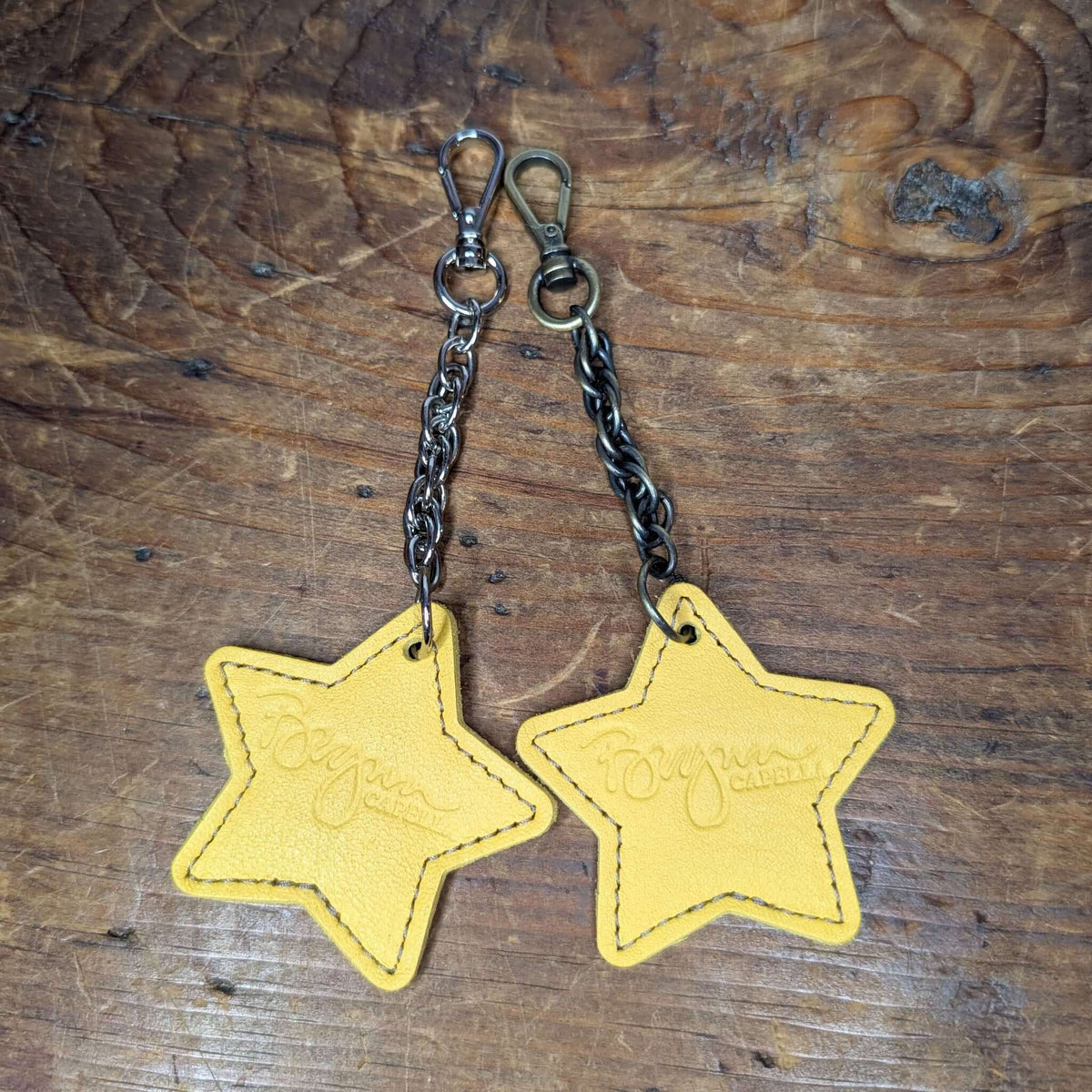 Bag charms - Yellow Star leather bag charms featuring gold star shapes with clips for bags or keys.