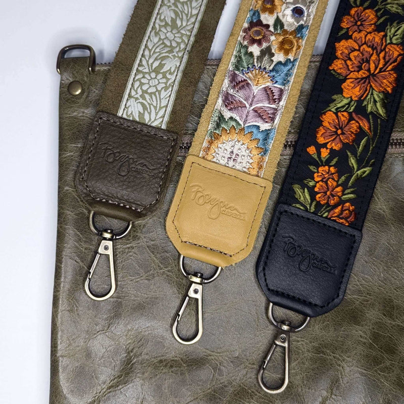 Guitar Bag Strap collection showcasing floral designs and leather trims, perfect for enhancing your bag's style.