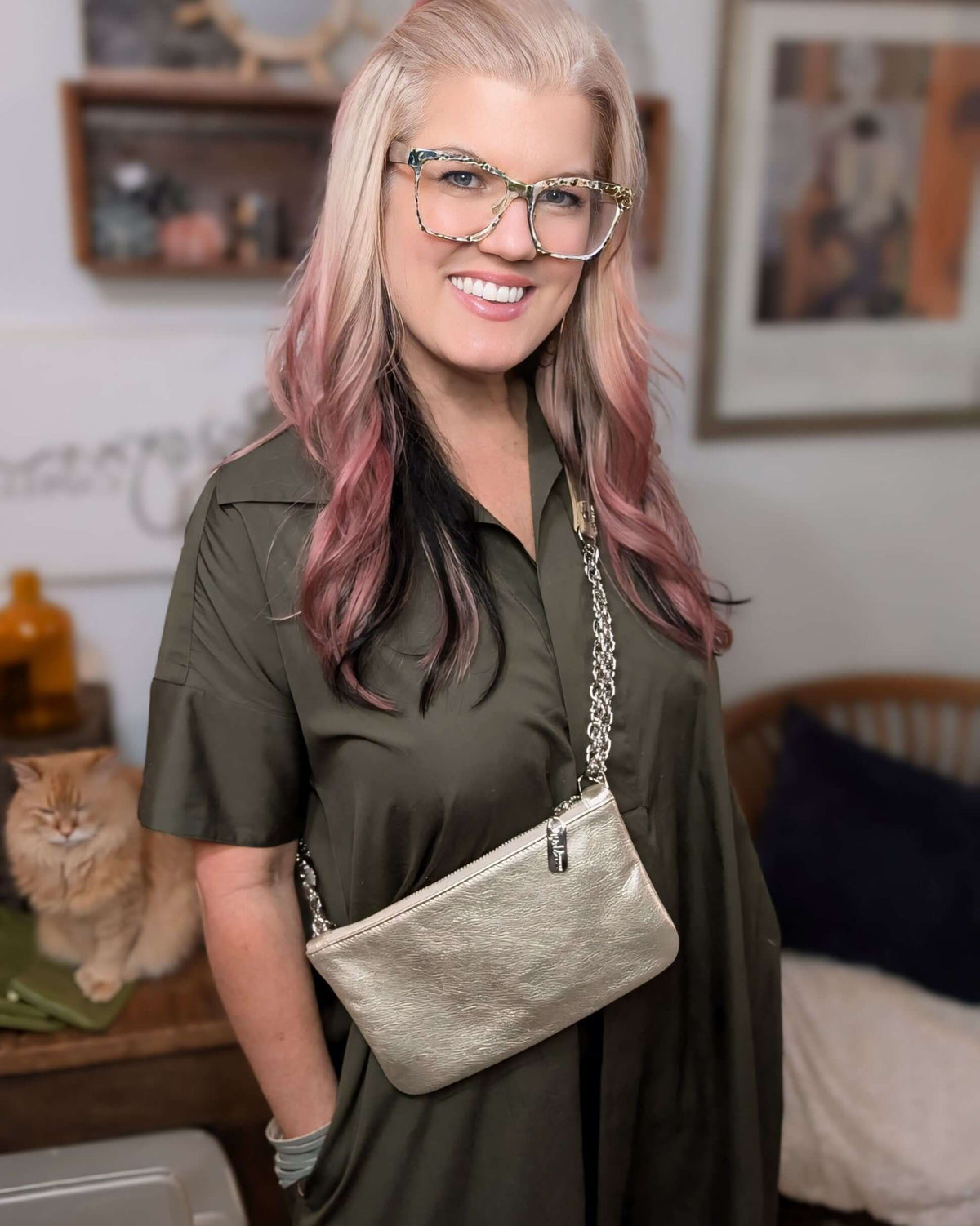 Cher Chain Crossbody - Champagne worn by a model, showcasing its metallic leather design and chain strap.
