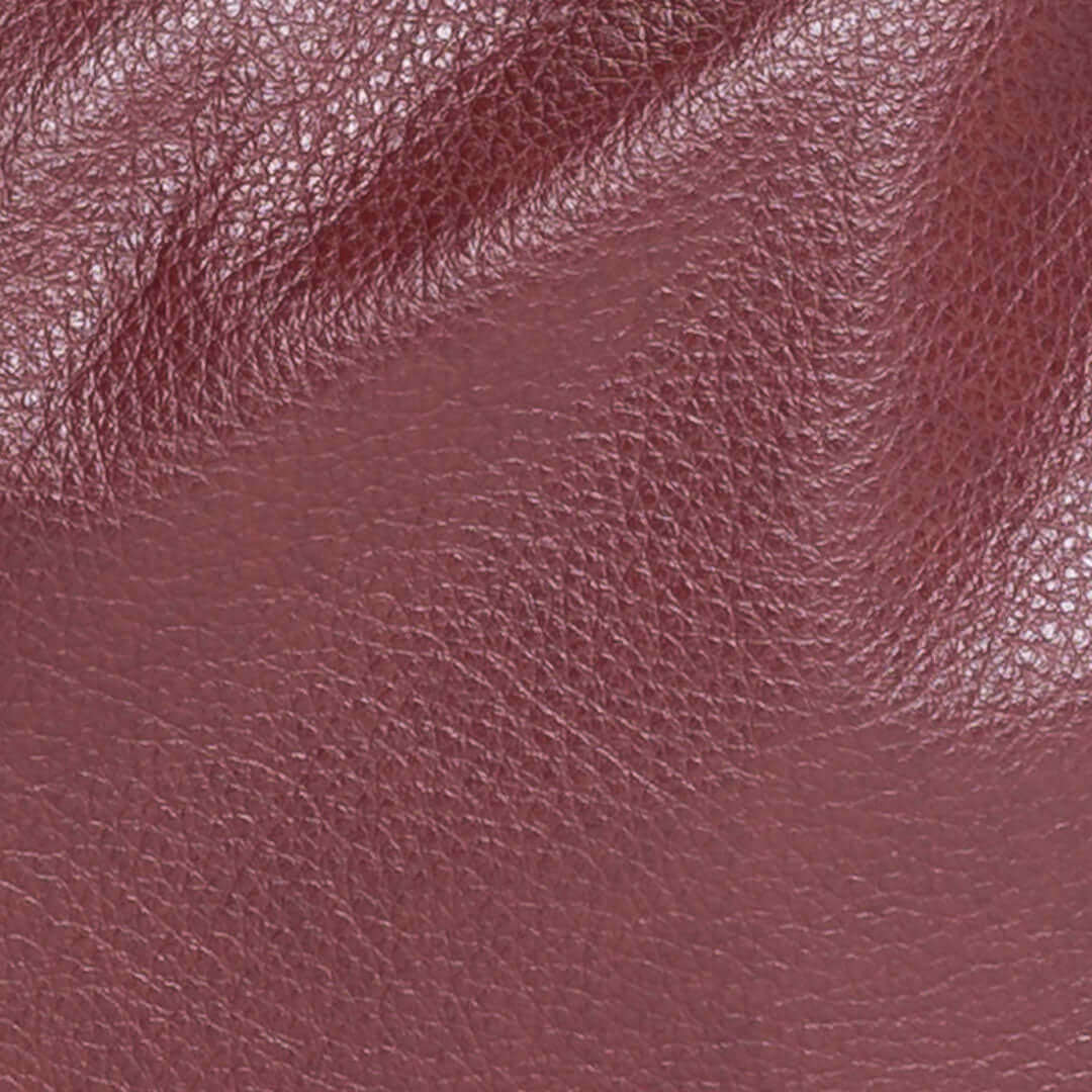 Close-up of the rich texture of burgundy leather for the Original Lauren 6-in-1 leather crossbody bag.