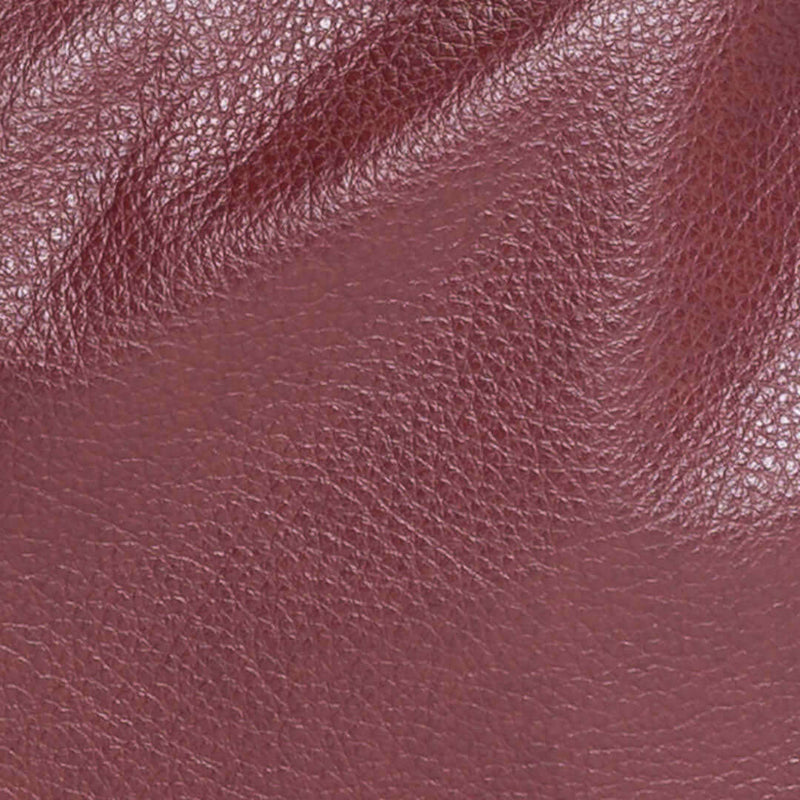 Close-up of the rich texture of burgundy leather for the Original Lauren 6-in-1 leather crossbody bag.
