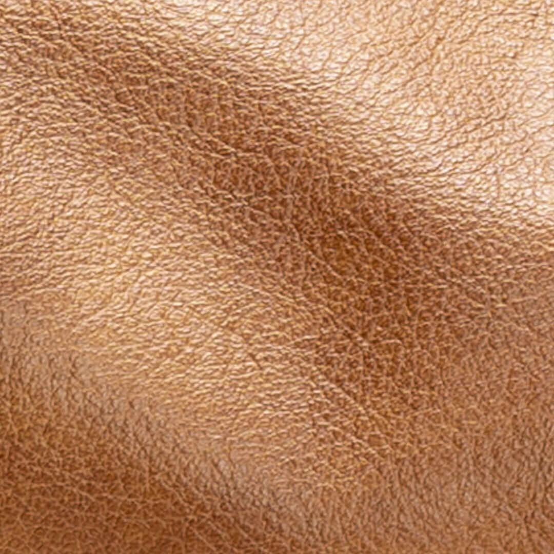 Close-up of luxurious golden tan leather used in the Original Lauren leather crossbody bag.