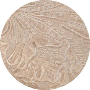 Close-up of an intricately designed textured surface, showcasing floral patterns in a neutral color.