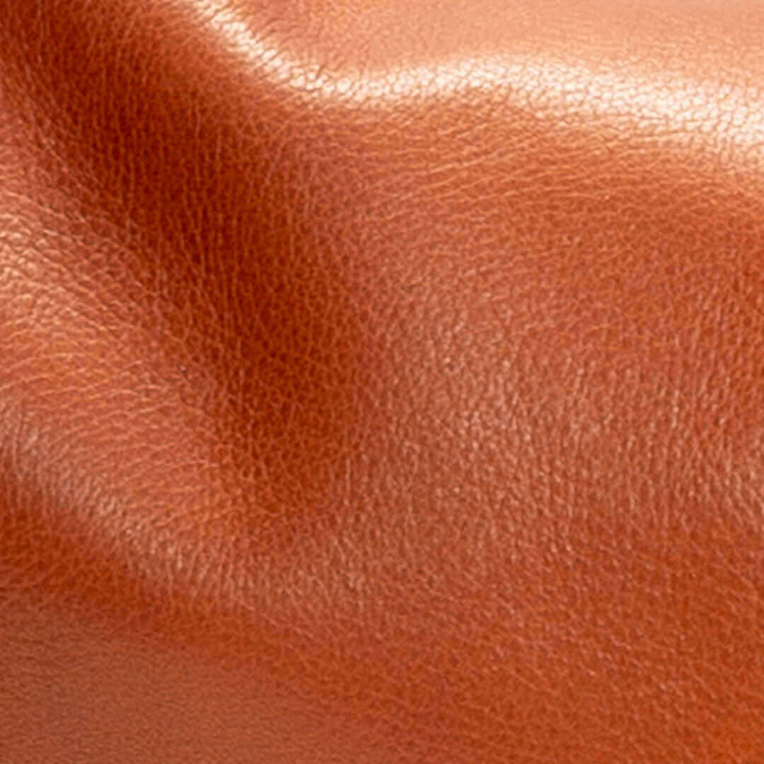 Close-up texture of whiskey leather for the Original Lauren leather crossbody bag.