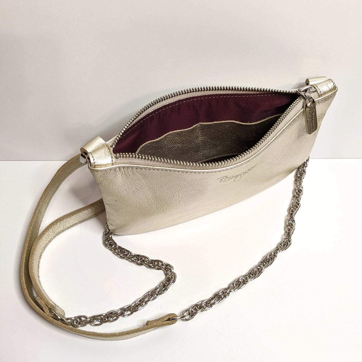 Cher Chain Crossbody - Champagne showing the interior and chain strap detail of the metallic leather bag.