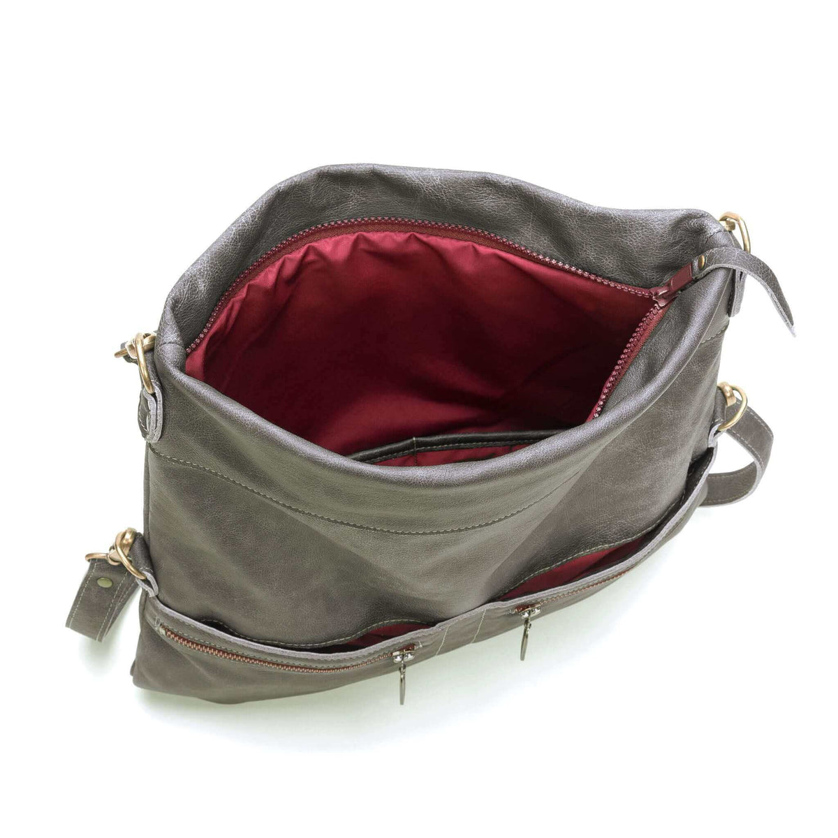 Interior view of Original Lauren leather crossbody bag showing spacious red lining and storage pockets.