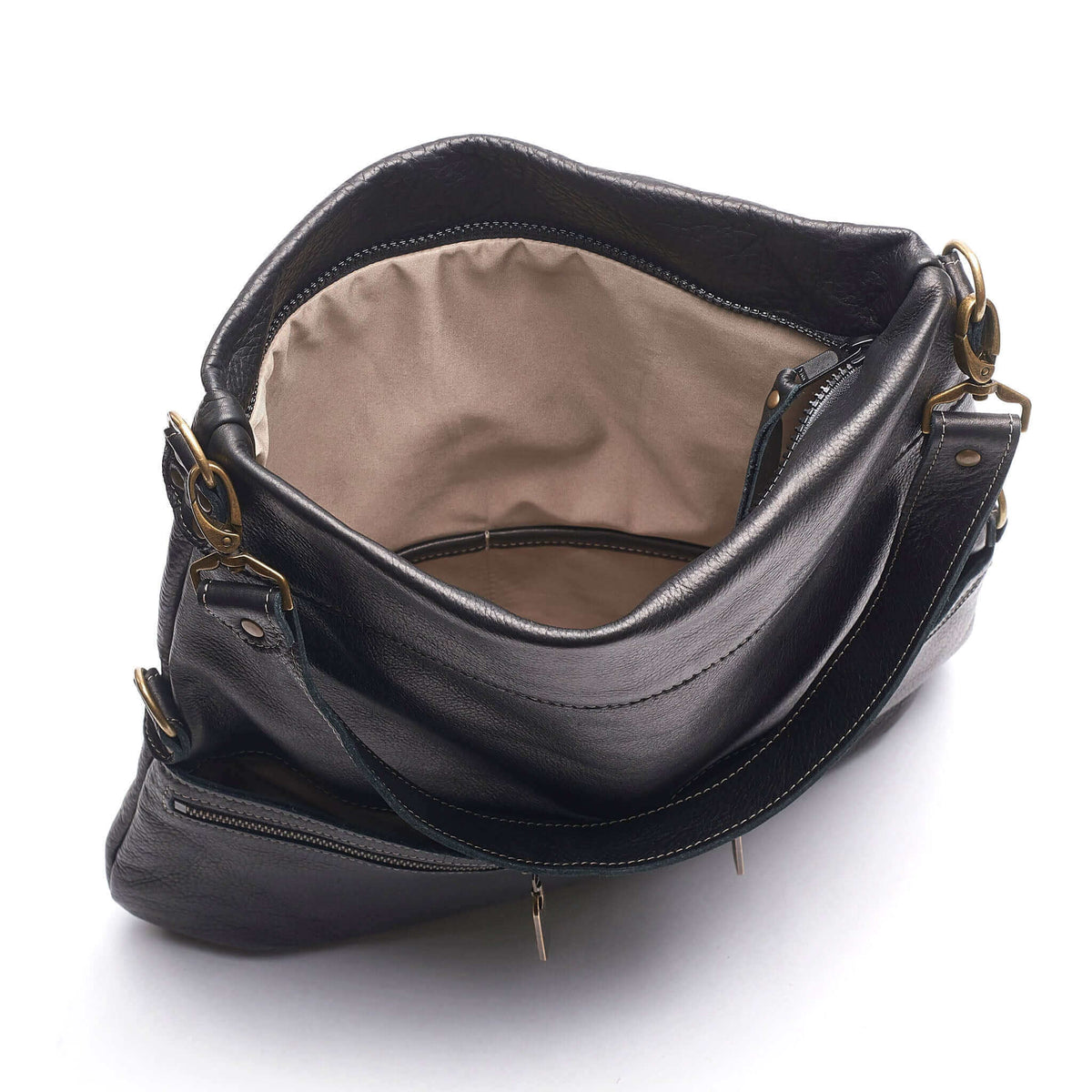 Interior view of the Original Lauren 6-in-1 Leather Crossbody Bag - Black Sand showing spacious pockets.
