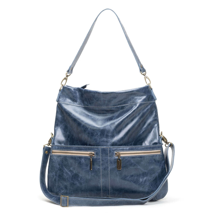 Leather crossbody bag in navy blue with zippered pockets and adjustable shoulder strap.