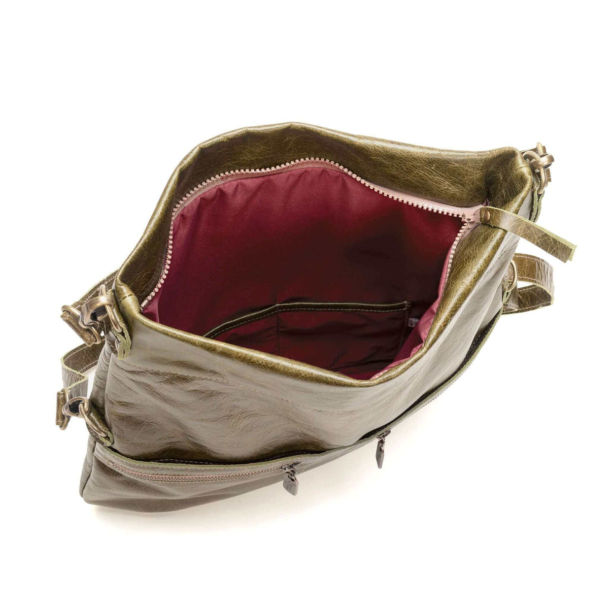 Interior view of the Original Lauren leather crossbody bag showcasing ample storage and rich lining.