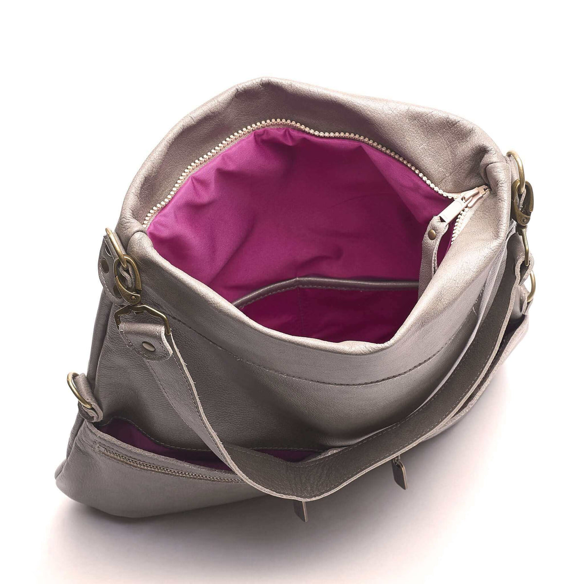 Inside view of Mini Lauren 6-in-1 Convertible Leather Crossbody Bag - Stone Temple featuring a vibrant pink lining.