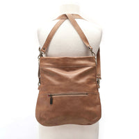 Mini Lauren leather crossbody bag shown in brown, demonstrating its convertible backpack style.