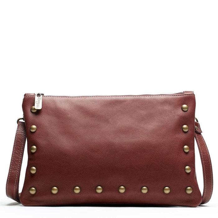 Studded crossbody bag in wine full-grain leather convertible clutch-to-crossbody with adjustable strap