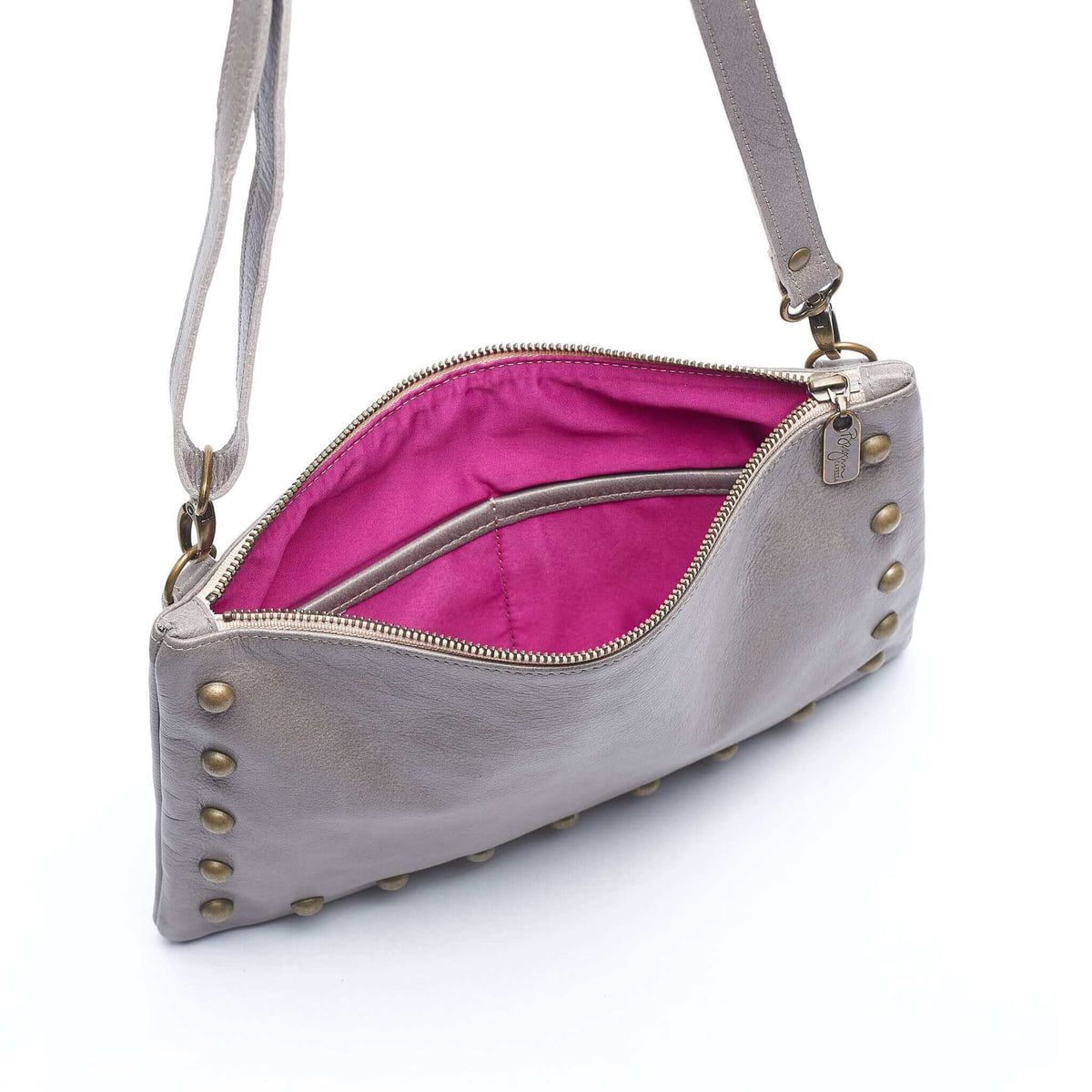 Interior of studded crossbody bag in light grey full-grain leather small crossbody bag with detachable strap