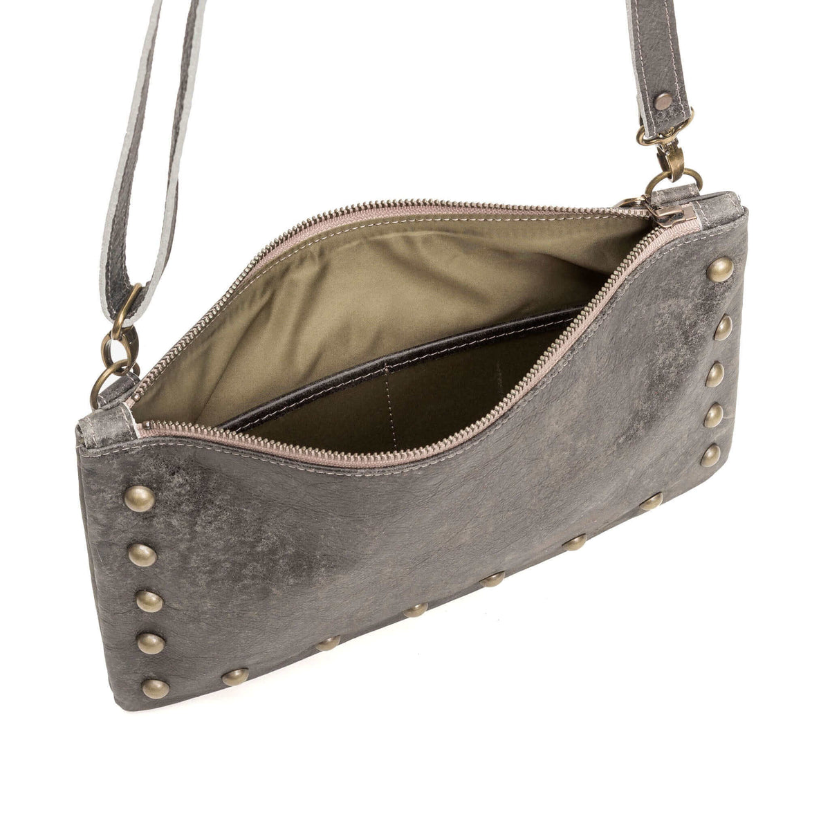 Interior of studded crossbody bag in light charcoal full-grain leather small crossbody bag with detachable strap