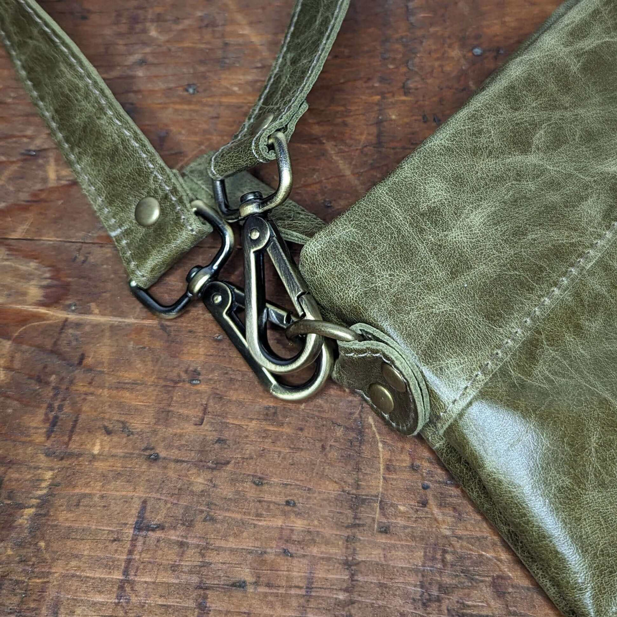 Close-up of high-quality hardware for Original Lauren 6-in-1 leather crossbody bag. 